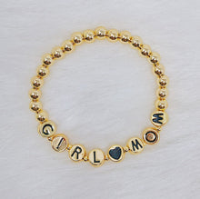 Gold Tone Ball Bead Bracelet With Black Stamped Letter Beads