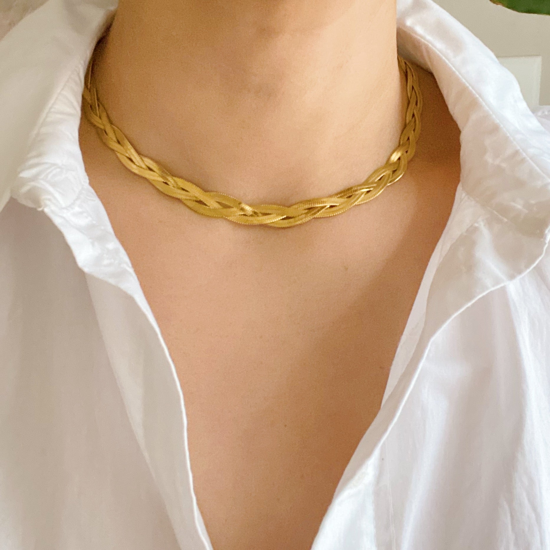 Sold at Auction: 18K TRI TONE GOLD BRAIDED HERRINGBONE NECKLACE
