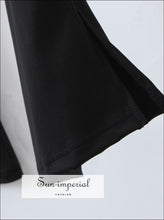 Black stretch flare pants with side slit - Sun Imperial (photo 2)